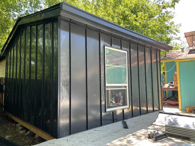 Black standing seam metal wall panels for Roof Inspection in Benbrook