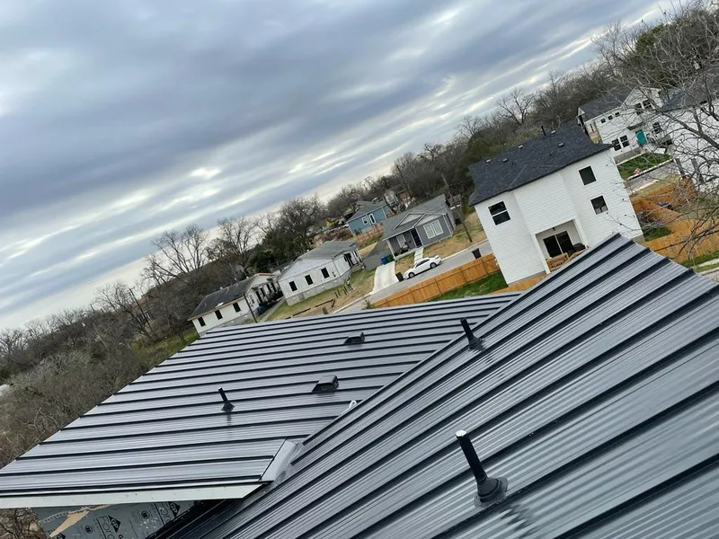 Standing seam metal roof panels with vents for Skylight Repair in Benbrook